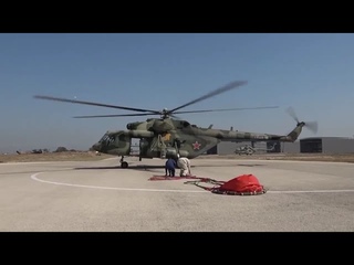 The crew of the Russian Mi-8AMTSh helicopter fights fires in Syria