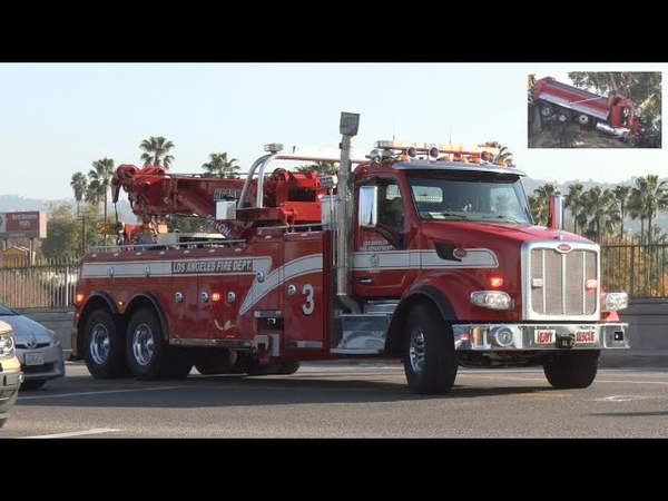 Rescue response as dump truck goes off the side in Los