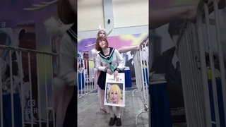 Masters fight at the comic exhibition. Passerby's perspective cosplaying as a queen