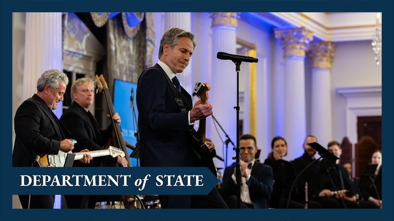 Secretary of State Blinken plays guitar at the launch of the Global Music Diplomacy