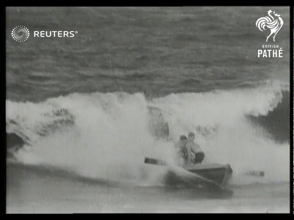 AUSTRALIA: Lifeguards parade, surfing in rowboats