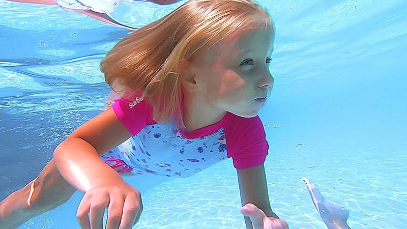 Baby girls play at Amusement Water Park with Slide and Swimming